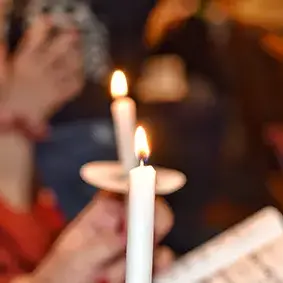 Worship moment with candlelight during a church gathering in Spragge